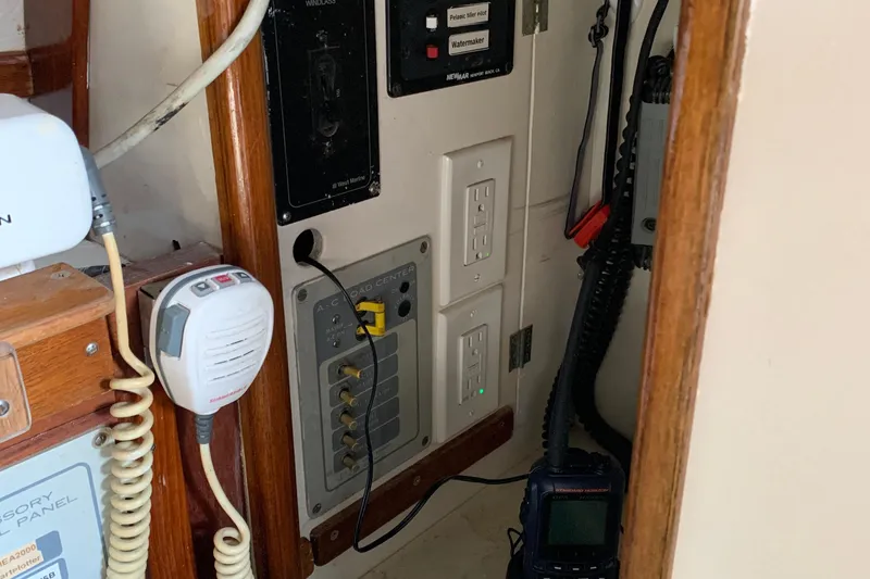 Slide: The Image of Electrical panel and communication equipment inside a 1972 Tartan 41 sailboat. - 60