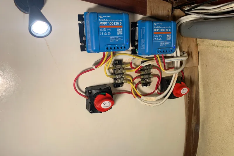Slide: The Image of Electrical setup with Victron Energy SmartSolar charge controllers on a 1972 Tartan 41. - 72