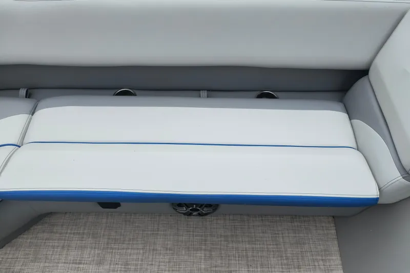 Slide: The Image of 2025 SunCatcher Select 324RC boat seating with gray and blue upholstery. - 11