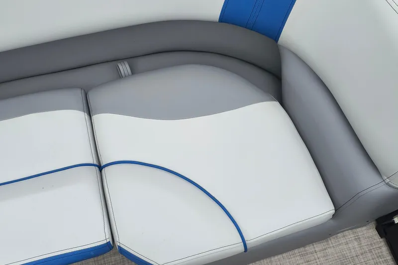 Slide: The Image of 2025 SunCatcher Select 324RC boat seat with gray and blue accents. - 14