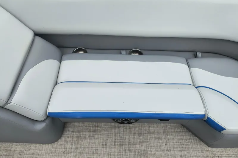 Slide: The Image of 2025 SunCatcher Select 324RC boat seating, featuring gray and white upholstery with blue accents. - 16