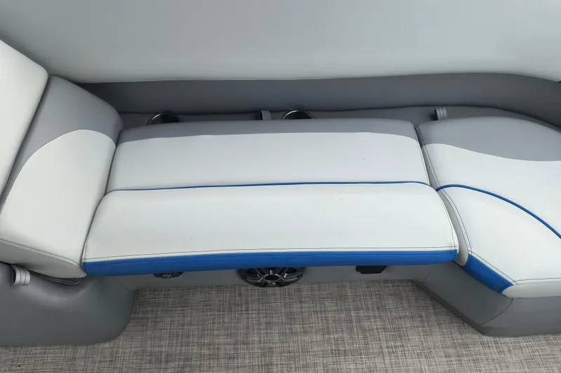 Slide: The Image of 2025 SunCatcher Select 324RC boat seating with gray and blue upholstery. - 25