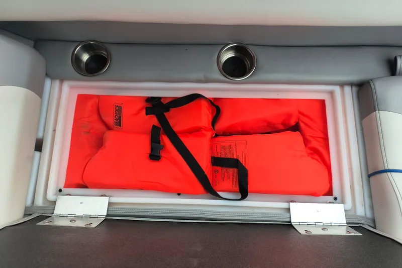 Slide: The Image of Storage compartment with life jackets in 2025 SunCatcher Select 324RC boat. - 26