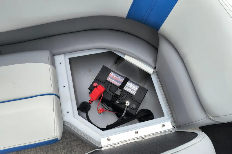 Slide: The Image of Battery compartment in 2025 SunCatcher Select 324RC boat, featuring cushioned seating. - 28