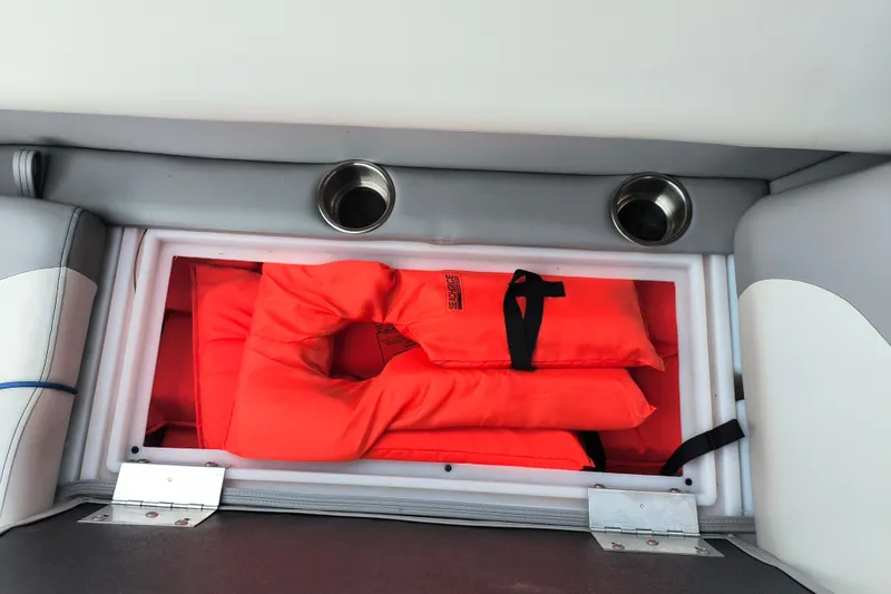 Slide: The Image of Storage compartment with life jackets on SunCatcher Select 324RC, 2025 model. - 33