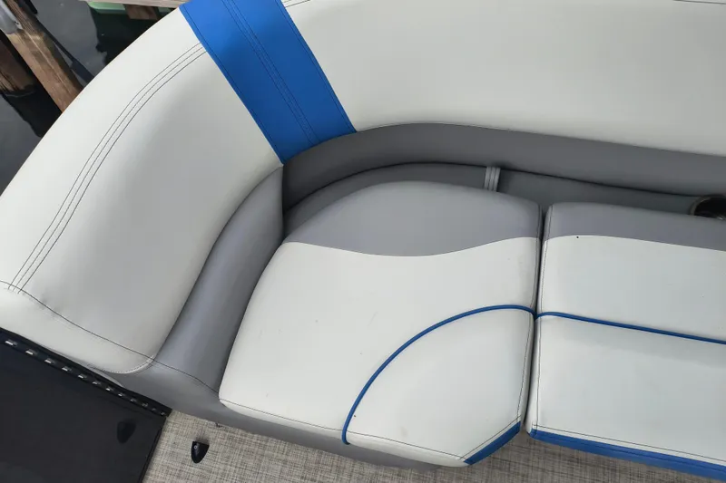 Slide: The Image of 2025 SunCatcher Select 324RC boat seating with blue and gray accents. - 34