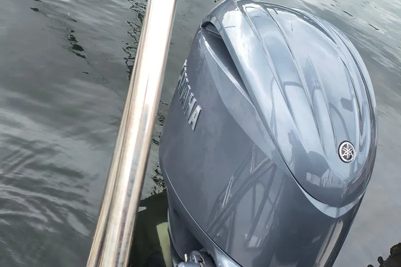 Slide: The Image of 2025 SunCatcher Select 324RC with Yamaha outboard motor on water. - 38