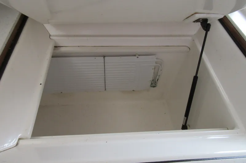 Slide: The Image of Open storage compartment on 2001 Catana 471 yacht, featuring hydraulic support. - 102