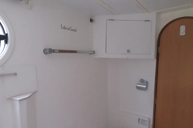 Slide: The Image of Interior of 2001 Catana 471 yacht bathroom with "Life is Good" text. - 126