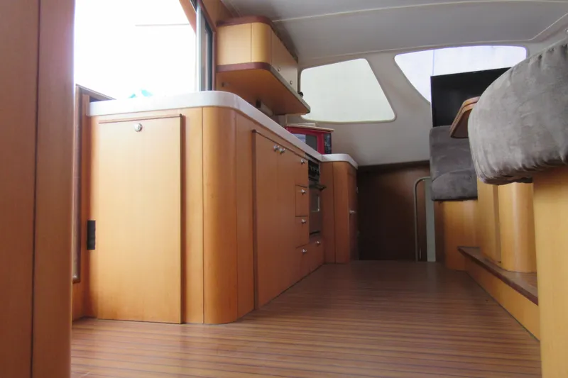 Slide: The Image of Interior of 2001 Catana 471 yacht with wooden cabinetry and modern design. - 132