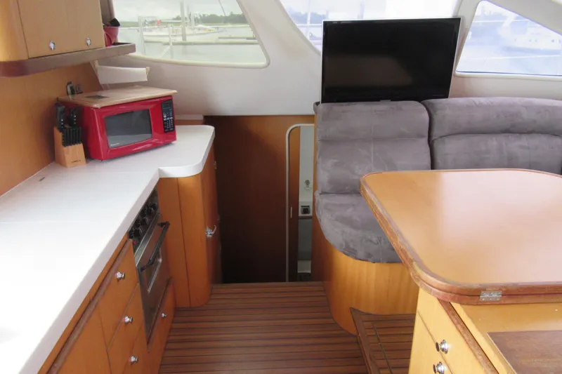 Slide: The Image of Interior of 2001 Catana 471 yacht with kitchen and seating area. - 134