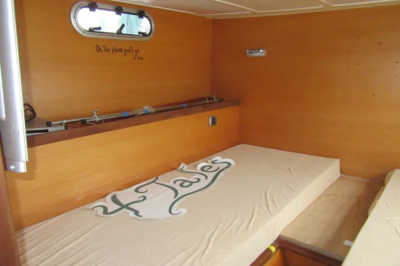Slide: The Image of Interior cabin of 2001 Catana 471 yacht with wooden walls and bedding. - 139
