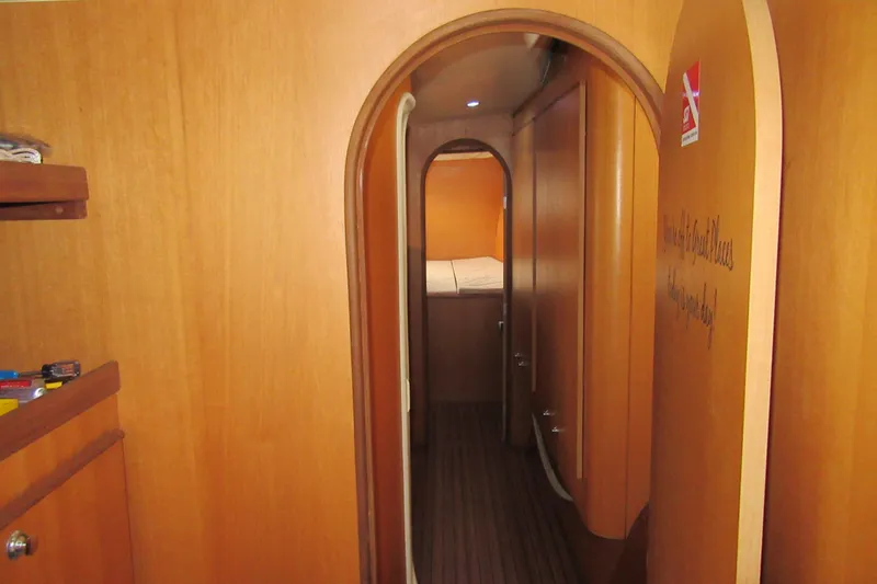 Slide: The Image of Interior of 2001 Catana 471 yacht with wooden paneling and cozy cabin view. - 144