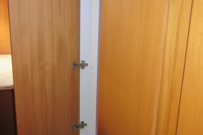 Slide: The Image of Wooden interior door with hinges on a 2001 Catana 471 yacht. - 146
