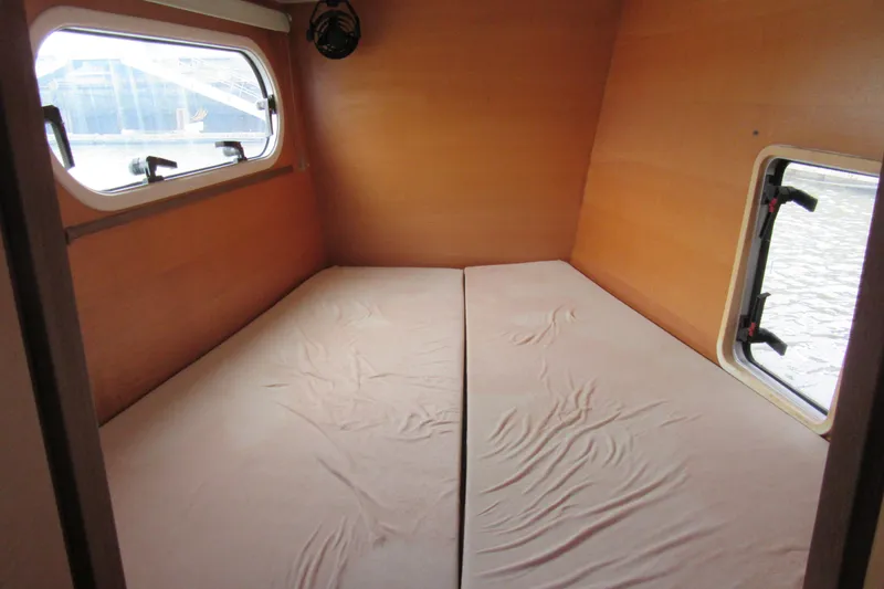 Slide: The Image of Interior cabin of 2001 Catana 471 yacht with twin beds and windows. - 152
