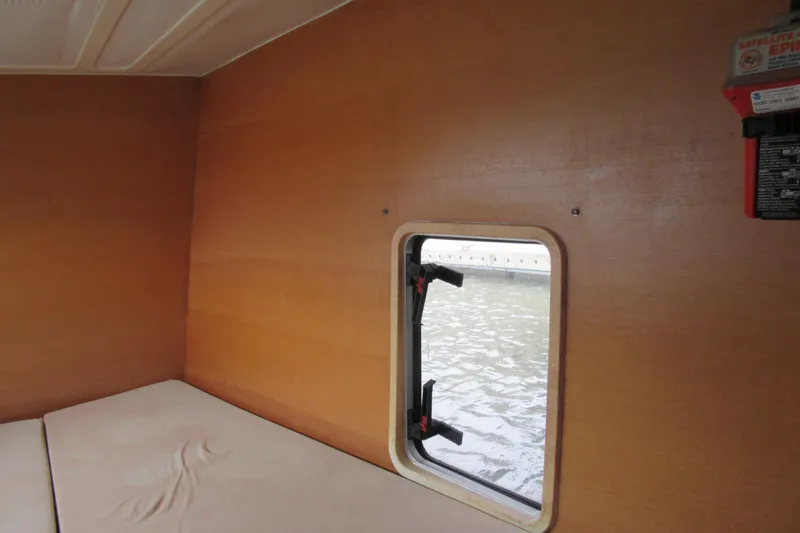 Slide: The Image of Interior cabin of 2001 Catana 471 yacht with window view of water. - 154