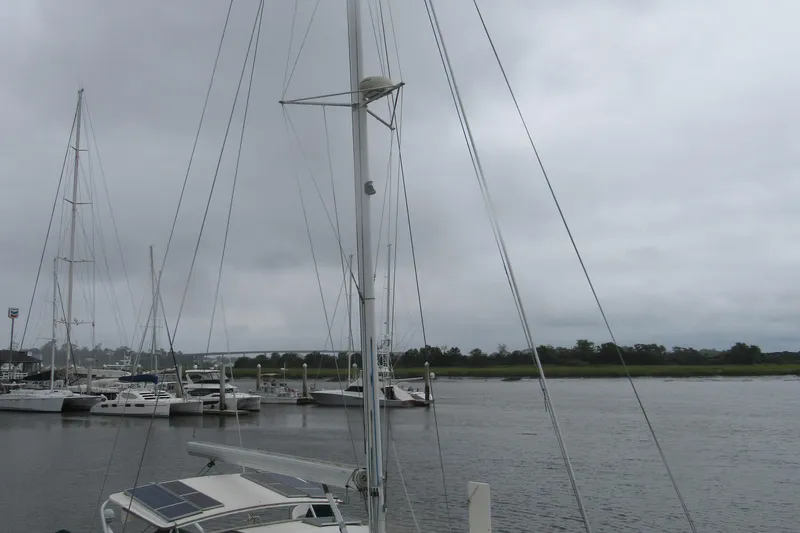 Slide: The Image of Catana 471 catamaran docked at a marina under overcast skies, 2001 model. - 158