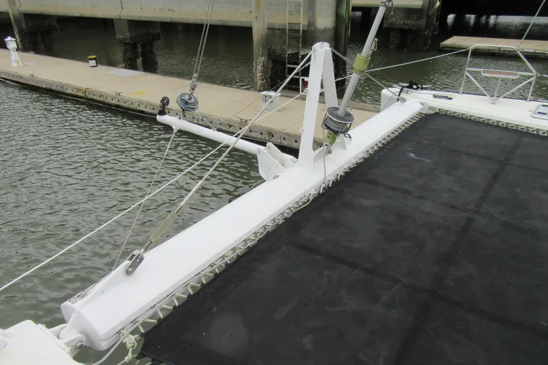 Slide: The Image of Catana 471 catamaran from 2001 docked at a marina, featuring deck and rigging. - 19