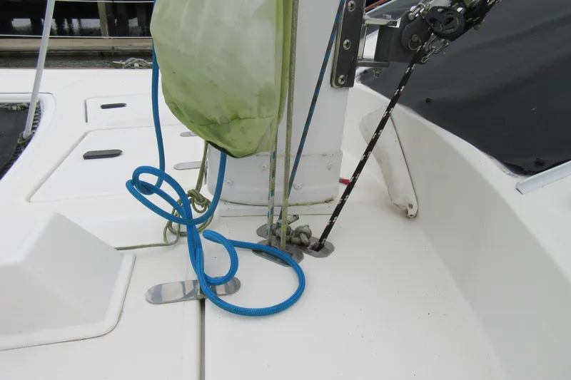 Slide: The Image of Deck of 2001 Catana 471 sailboat with ropes and fittings. - 23