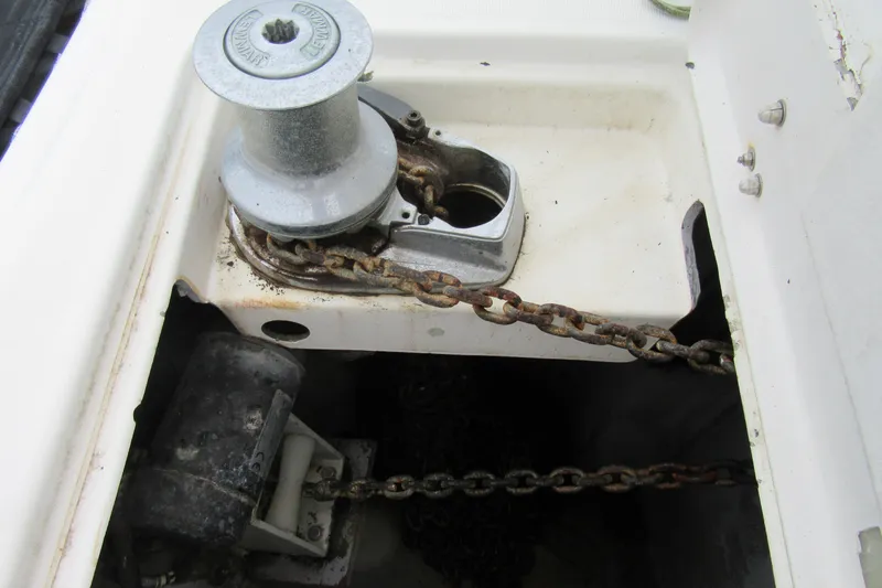 Slide: The Image of Anchor windlass system on a 2001 Catana 471 sailboat, featuring a chain mechanism. - 24