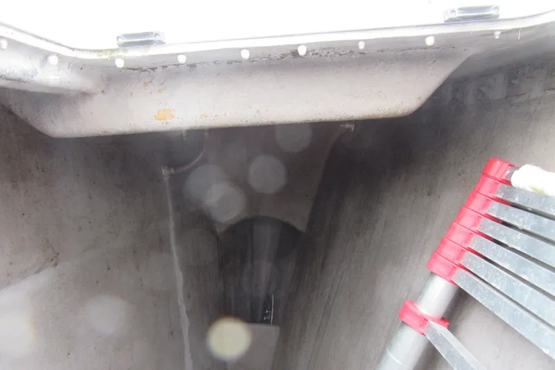 Slide: The Image of Interior view of a 2001 Catana 471 yacht with ladder and storage compartment. - 43