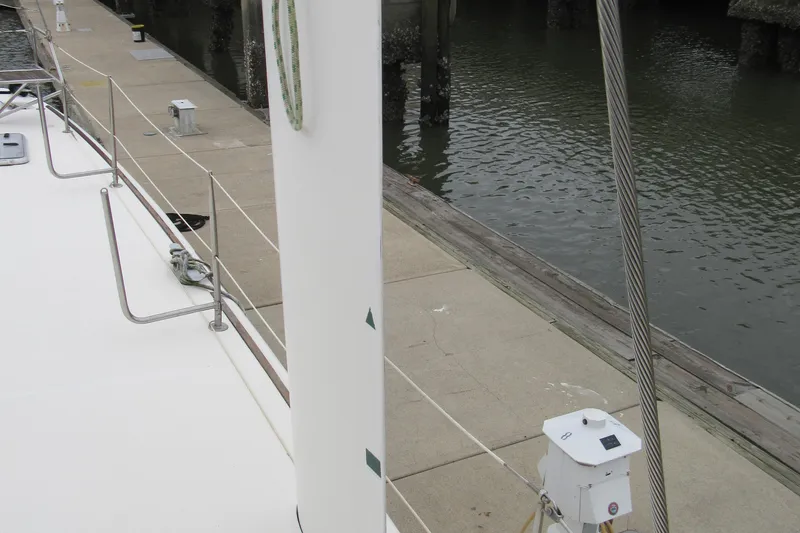 Slide: The Image of Catana 471 catamaran docked at marina, showing deck and mooring area, 2001 model. - 50