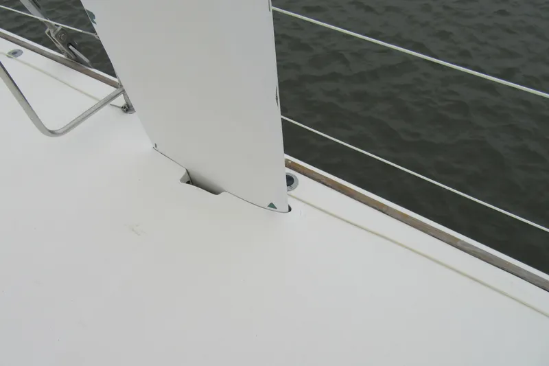 Slide: The Image of Catana 471 sailboat deck detail, 2001 model, with railing and water view. - 53