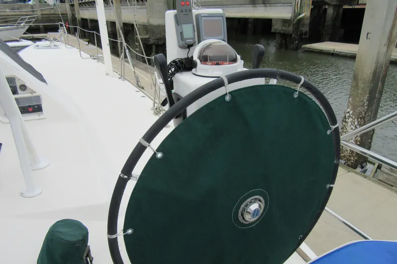 Slide: The Image of Steering wheel of a 2001 Catana 471 yacht docked at a marina. - 57