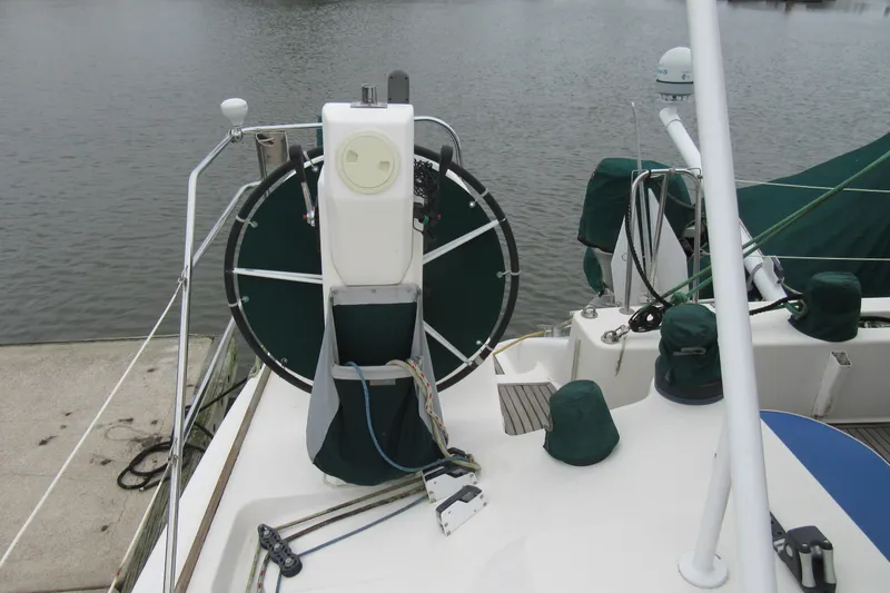Slide: The Image of Catana 471 sailboat helm, 2001 model, docked by the water. - 59
