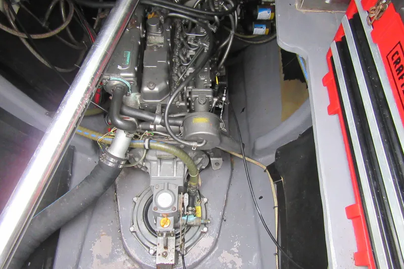 Slide: The Image of Engine compartment of a 2001 Catana 471 catamaran, showcasing mechanical components and wiring. - 61