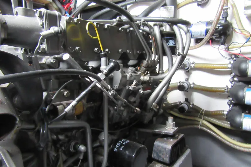 Slide: The Image of Engine compartment of a 2001 Catana 471, showcasing intricate mechanical components and wiring. - 63