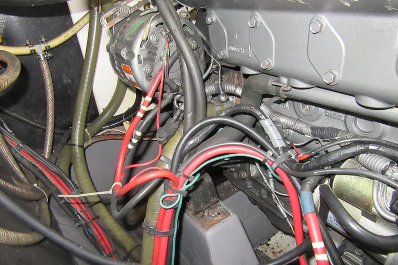 Slide: The Image of Engine compartment of a 2001 Catana 471 with visible wiring and components. - 64