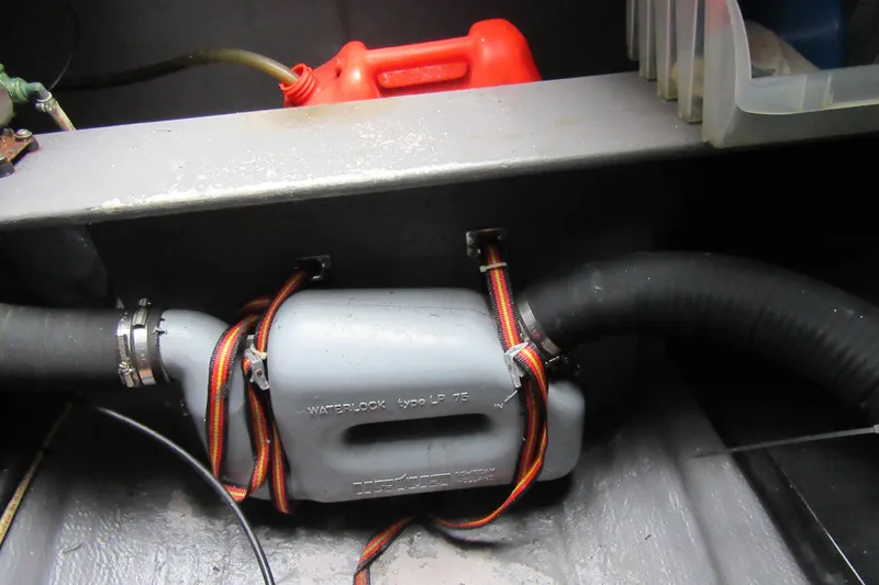 Slide: The Image of Engine compartment of 2001 Catana 471 with waterlock and hoses. - 69