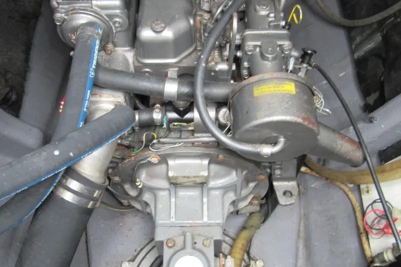 Slide: The Image of Engine compartment of a 2001 Catana 471, showcasing mechanical components and hoses. - 74
