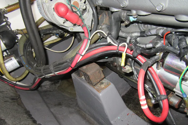 Slide: The Image of Engine compartment of a 2001 Catana 471 with visible wiring and components. - 77