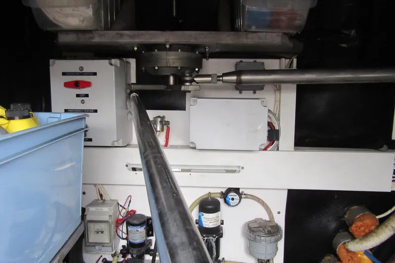 Slide: The Image of Engine compartment of a 2001 Catana 471, featuring mechanical and electrical components. - 80