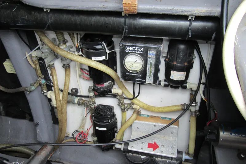 Slide: The Image of Catana 471 (2001) yacht water system with Spectra watermaker and hoses. - 82