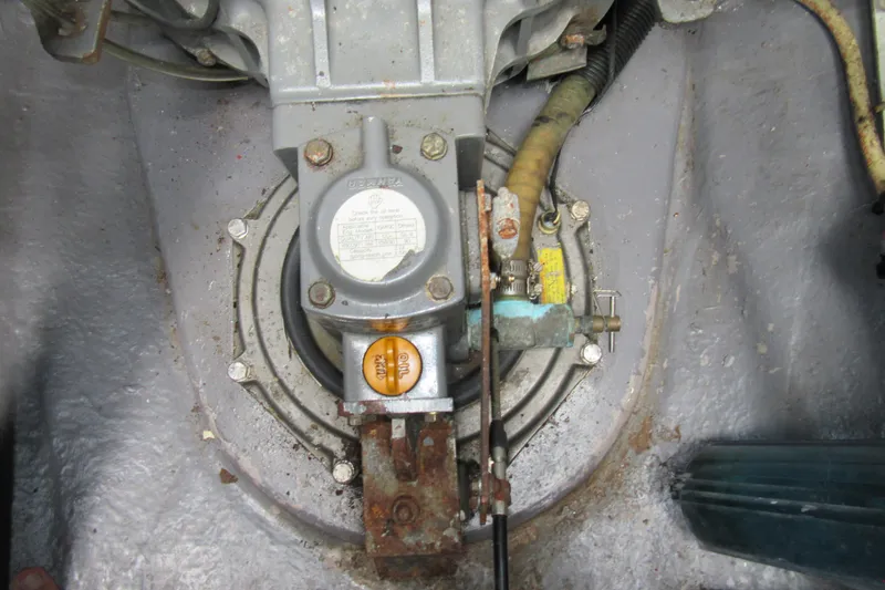 Slide: The Image of Engine component of a 2001 Catana 471 catamaran, showing mechanical details and connections. - 86