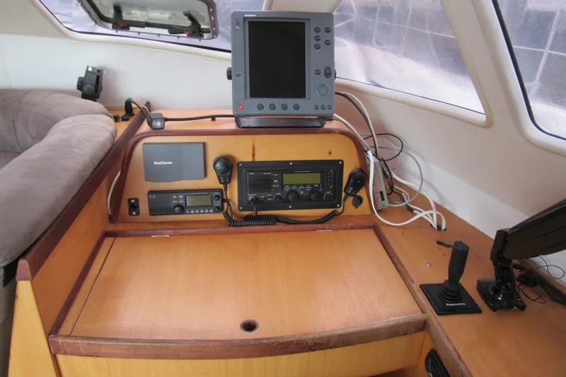 Slide: The Image of Navigation equipment on a 2001 Catana 471 yacht, featuring control panel and communication devices. - 96