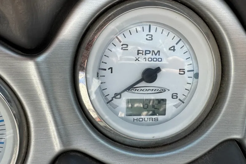 Slide: The Image of Close-up of 2006 Moomba Mobius XLV RPM gauge displaying engine hours. - 11