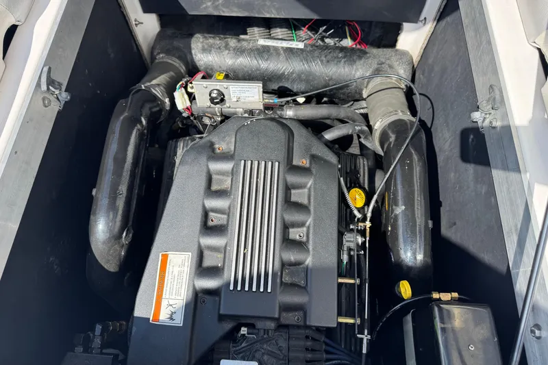 Slide: The Image of 2006 Moomba Mobius XLV engine compartment with visible components and wiring. - 12