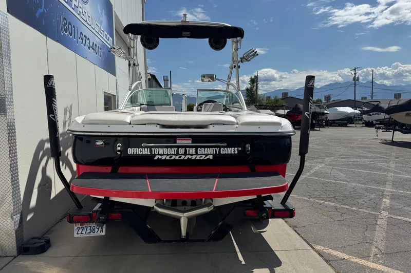 Slide: The Image of 2006 Moomba Mobius XLV boat parked outdoors, featuring "Official Towboat of the Gravity Games" branding. - 2