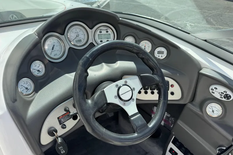 Slide: The Image of 2006 Moomba Mobius XLV boat dashboard with steering wheel and gauges. - 6