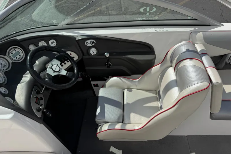 Slide: The Image of 2006 Moomba Mobius XLV boat interior with steering wheel and control panel. - 7