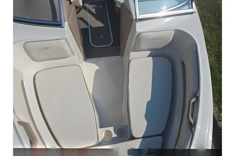 Slide: The Image of 1998 Regal Valanti 176 boat interior with cushioned seating and cup holders. - 17