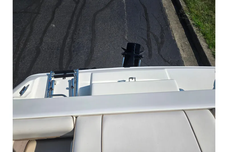 Slide: The Image of 1998 Regal Valanti 176 boat rear view with ladder and motor on pavement. - 22