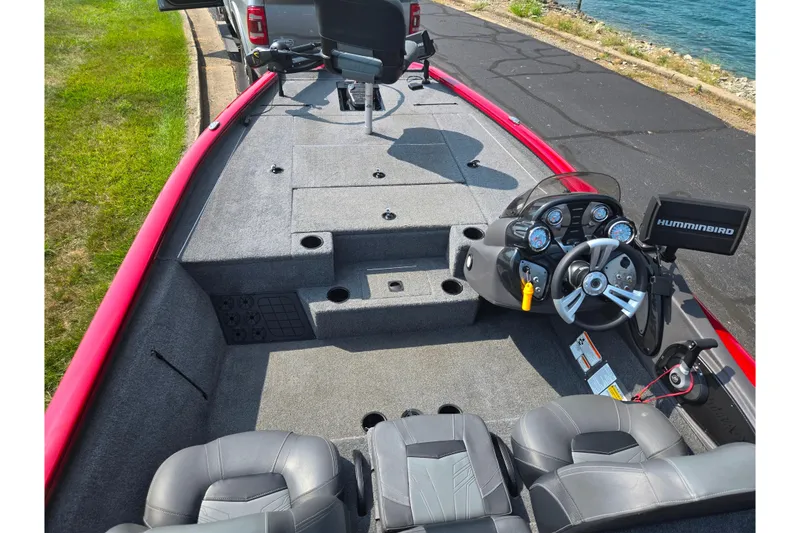 Slide: The Image of 2020 Tracker Pro Team 195 TXW Tournament Edition boat interior with steering console and seating. - 11
