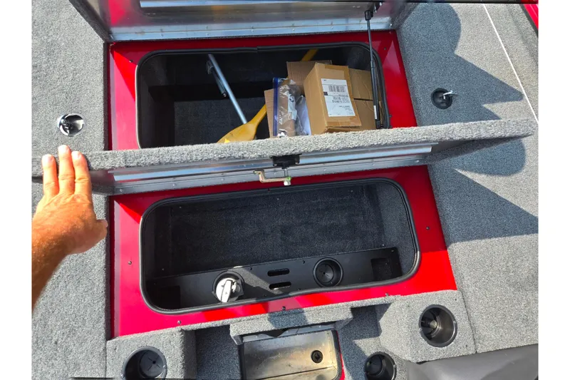 Slide: The Image of 2020 Tracker Pro Team 195 TXW Tournament Edition boat storage compartments open. - 16