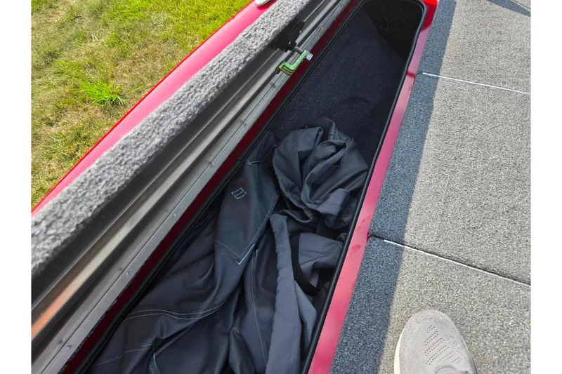 Slide: The Image of Open storage compartment in 2020 Tracker Pro Team 195 TXW Tournament Edition boat. - 18