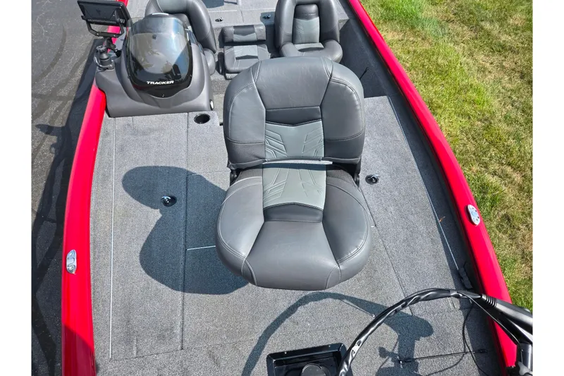Slide: The Image of 2020 Tracker Pro Team 195 TXW Tournament Edition boat with gray seating and red trim. - 21